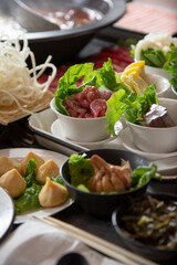 A view of all the elements of a hot pot meal.
