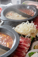 A view of all the elements of a hot pot meal.