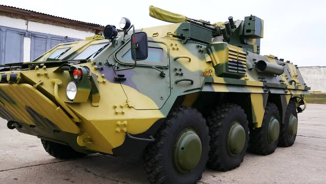 An armored personnel carrier of the Ukrainian army stands at the hangar before leaving for the combat zone. Ukraine is defending itself after the invasion of the Russian army. Real war