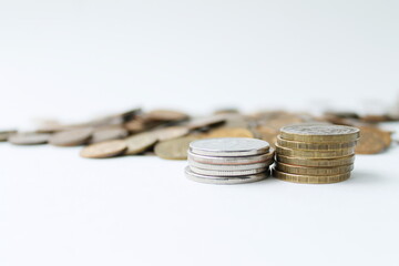 different coins on a white background, money, wealth, poverty