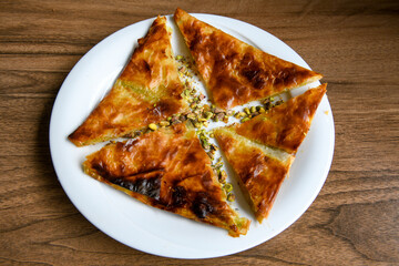 Homemade burek (borek)  with cheese and spinach and boiled egg.Traditional food. Peynirli, Patatesli, kiymali kol boregi.