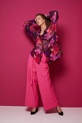 Young asian woman in blouse and pink pants.