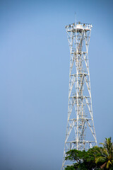 Lighthouse tower made of steel on the edge of the island