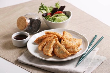 Modern Style fried gyoza or dumplings snack with soy sauce
