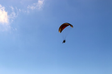 Paragliding in the sky over the Mediterranean Sea.