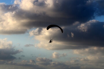 Paragliding in the sky over the Mediterranean Sea.