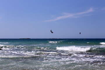 Paragliding in the sky over the Mediterranean Sea.
