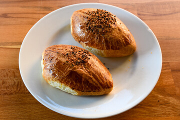 Turkish pastry product , tasty pogaca. Simit, gevrek. Turkish Pastries; peynirli, patatesli, kasarli pogaca, borek, acma, ay coregi at patisserie showcase.
