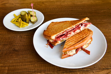 Turkish toast, mixed toast with cheddar cheese, sausage and ham, with fried potatoes (Turkish name; Bazlama Karisik tost)