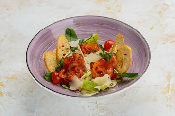 salad with salmon and bruschetta in a serene plate

