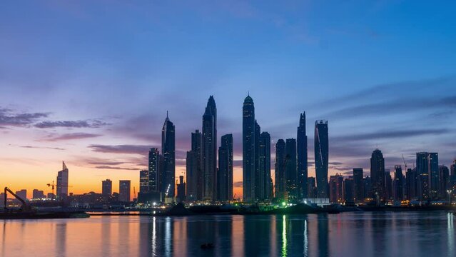 Time lapse of  sunrises with high rise building  in Dubai Marina, beautiful sky, 