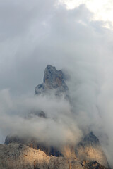 Mountain called Cimon della Pala with white clouds in the Italian Dolomites