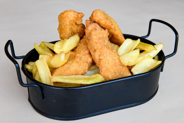 Fried Chicken breast hot crispy strips crunchy chicken tenders  isolated on white background.Nuggets isolated on white background on a plate