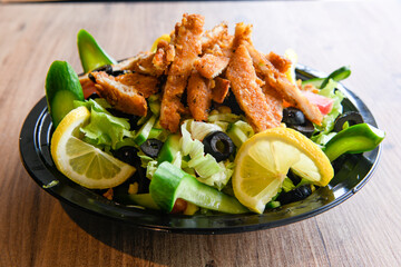 Fried Chicken breast hot crispy strips crunchy chicken tenders  isolated on white background.Nuggets isolated on white background on a plate