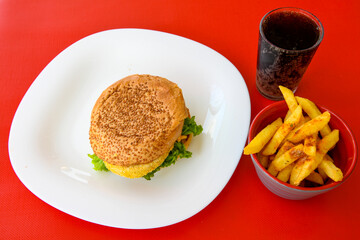 Big tasty burger with beef cutlet on a plate