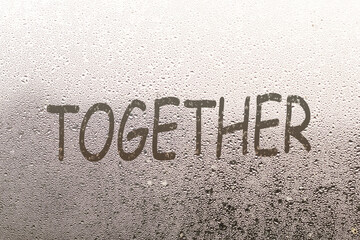 together written on a foggy window