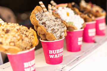 Chinese Hong Kong waffles with ice cream, jam and fruit. delicious bubble.