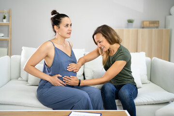 Fototapeta na wymiar Pregnant Woman Massage By Doula. Baby Care