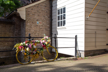 Flower bicycle parked on the street in the Netherlands