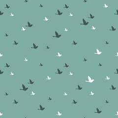 Fototapeta premium Seamless abstract pattern with flying birds on blue background.