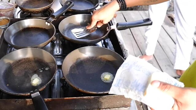 Adding and melting butter in hot pan, 4k video resolution, Indian or asian street food