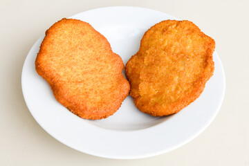 Fried Chicken breast hot crispy strips crunchy chicken tenders  isolated on white background.Nuggets isolated on white background on a plate