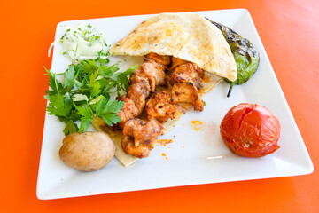 Chicken wings barbeque in a dish with BBQ grill sauce . Izgara tavuk kelebek sis kanat. Tavuk sis, gogus.
