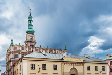 Obraz premium The city hall building with the town hall tower in the background. Zamość is a city entered on the World Heritage List. Zamosc, Poland