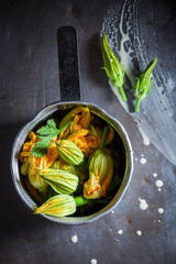 Ingredients for roasted zucchini flower as seasonal snack.