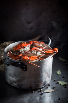 Ingredients for fresh red crabs with bay leaf and allspice.
