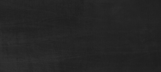 Black chalkboard texture with space for text or drawing