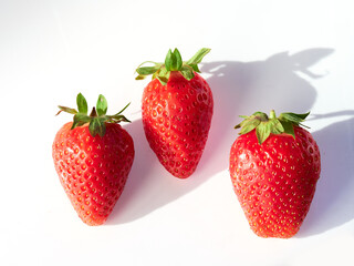 Fresh, red and delicious strawberries, on a white background