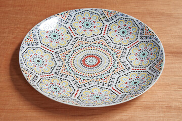 islamic oriental plate on wooden background