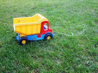 Fototapeta premium Photo on theme of plastic large children's toy truck