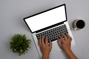 Fototapeta premium Overhead view woman hands typing on laptop computer. Blank screen for your advertise text