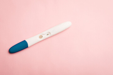 Pregnancy test on a pink background . Positive test. Pregnancy copy space.