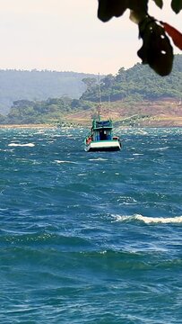 Vertical Video of a Khmer Fishing Boat in the Rough Sea