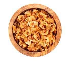 Roasted onions in wooden bowl, isolated on white background. Crispy fried onions. Top view.