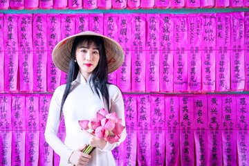 Vietnam woman wearing Ao Dai culture traditional at old temple at Ho Chi Minh in Vietnam,vintage style,travel and relaxing concept. - 521611991