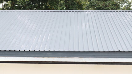 The gray metal sheet roof comprises the top floor of the building.