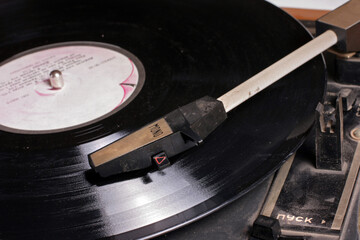 Vintage vinyl record player on a white background