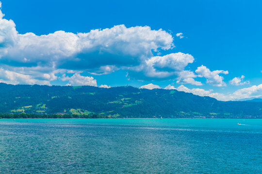 Germany, Beautiful panorama view above lakeside of turquoise bodensee lake water at austrian coast at bregenz pfaender mountain