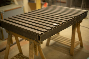 Steel table. Industrial processing. Details of work with structure.