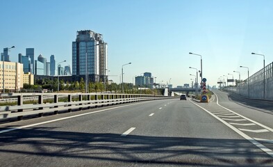 The road separates, one of the roads leads to the bridge
