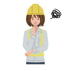 立って手をあごにあてて困っている工事現場の女性