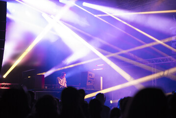 Dj playing techno music on the live night concert in summer