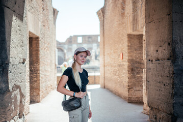 Fototapeta na wymiar A girl tourist in Ancient Colosseum in Rome, Italy famous travel destinations