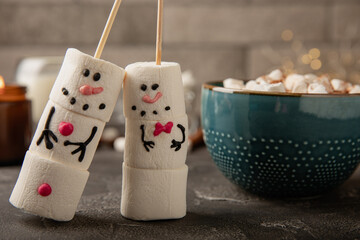 Snowman made of marshmallows.Cocoa drink.Sweet treat for kids funny marshmallow snowman. Christmas winter holiday decoration. New Year card.Winter hot drink.