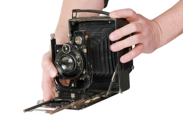 Old antique vintage black camera the 19th century isolated on white background with cliping path. Russia.