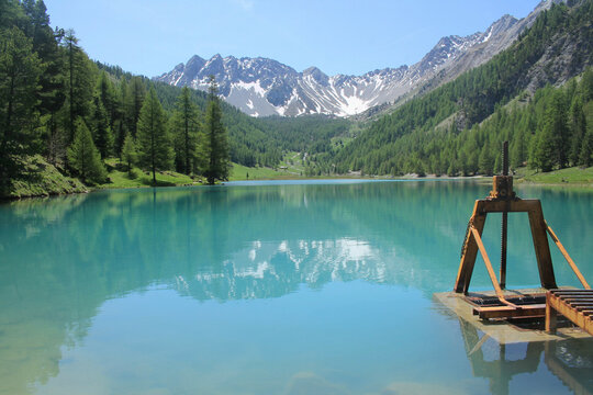 The wonderful Orceyrette Lake in autumn with larch tree forest, Briancon, hautes alpes, french alps